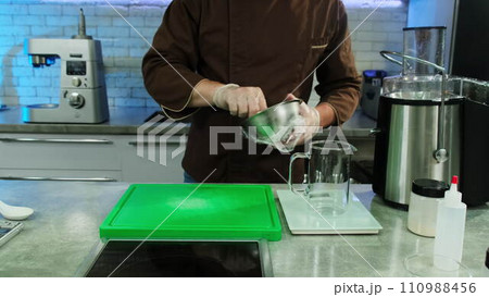 Kitchen worker prepares strawberry for making dessert 110988456