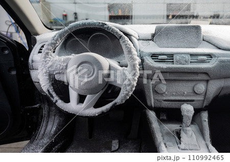 Car interior in a layer of cleaning foam. Car interior in a layer of cleaning foam. 110992465