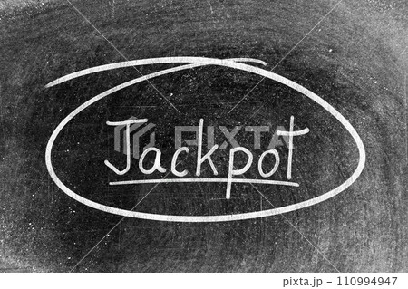 White chalk hand writing in word jackpot and circle shape on blackboard background White chalk hand writing in word jackpot and circle shape on blackboard background 110994947