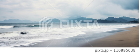 Sandy beach in nasty weather with big waves, stormy sea landscape with copyspace 110995039