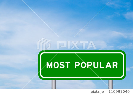Green color transportation sign with word most popluar on blue sky with white cloud background 110995040