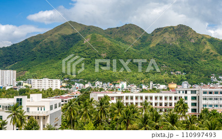Nha Trang cityscape, combining traditional charm with modernity. mountain skyline capture dynamic spirit of this Vietnamese gem 110997493