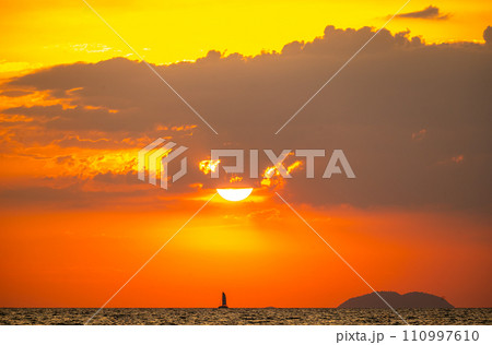 Fiery horizon, dramatic ocean sunset in vibrant hues over dark waters, nature breathtaking photo reflecting artistry of dusk's tranquil spectacle and coastal beauty Fiery horizon, dramatic ocean sunset in vibrant hues over dark waters, nature breathtaking photo reflecting artistry of dusk's tranquil spectacle and coastal beauty 110997610