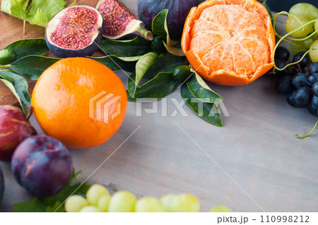 Season colorful fruit mix on light gray wooden board background with copy space Season colorful fruit mix on light gray wooden board background with copy space 110998212