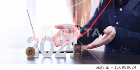 businessman buys gold and bitcoin in 2024 using digital technology and laptop computer. Finance and trade concept 2024. 110998624