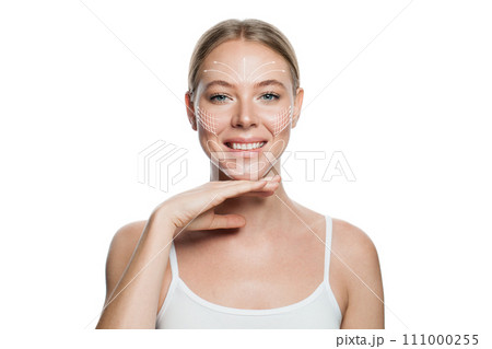 Beautiful female face with cute smile. Skin marked with arrows on the main facial lifting lines Beautiful female face with cute smile. Skin marked with arrows on the main facial lifting lines 111000255
