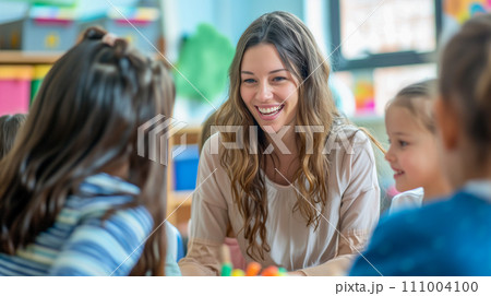 活発な教室でのディスカッションを熱心に指導する先生。優しい小学校教員のイメージ。AI画像 111004100