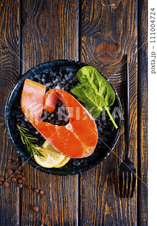 Salmon. Fresh raw salmon fish fillet with cooking ingredients Salmon. Fresh raw salmon fish fillet with cooking ingredients 111004724
