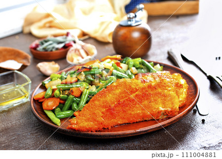 fish fillet with mixed vegetables on plate fish fillet with mixed vegetables on plate 111004881