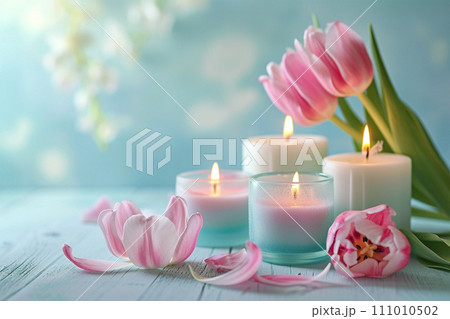 Pink yellow tulip flowers, lit candles on rustic wooden background. Greeting card Pink yellow tulip flowers, lit candles on rustic wooden background. Greeting card 111010502