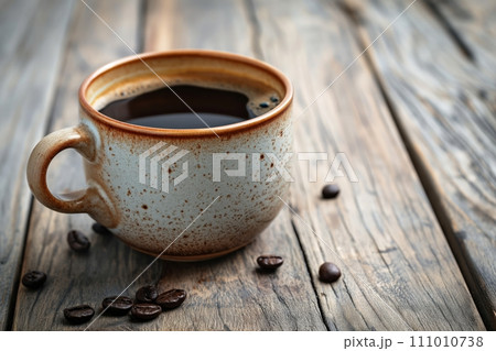 Cup of aromatic black coffee on a brown wooden background Cup of aromatic black coffee on a brown wooden background 111010738