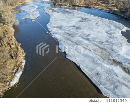 aerial view of the South Platte RIver and plains in eastern Colorado in winter scenery 111012549