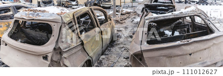 Kyiv, Ukraine - January 3, 2024: Burned civilians cars after a Russian's missiles attack Kyiv, Ukraine - January 3, 2024: Burned civilians cars after a Russian's missiles attack 111012627