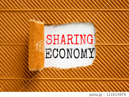 Sharing economy symbol. Concept words Sharing economy on beautiful white paper. Beautiful brown paper background. Business sharing economy concept. Copy space. 111013979