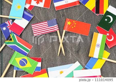 The concept is diplomacy. In the middle among the various flags are two flags - USA, China 111014095