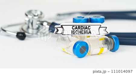On the table there is a stethoscope, injections and a sign with the inscription - cardiac ischemia On the table there is a stethoscope, injections and a sign with the inscription - cardiac ischemia 111014097