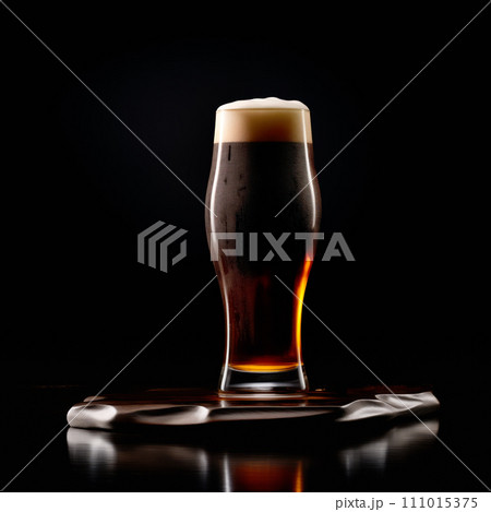 Beer in a tall glass on a dark black background. Mugs with drink like Ipa, Pale Ale, Pilsner, Porter or Stout Beer in a tall glass on a dark black background. Mugs with drink like Ipa, Pale Ale, Pilsner, Porter or Stout 111015375