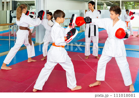 Kids boxing in gym, karate training Kids boxing in gym, karate training 111018081