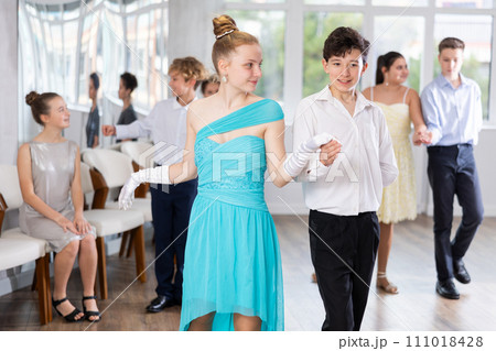 Boy and girl dancing waltz in studio Boy and girl dancing waltz in studio 111018428