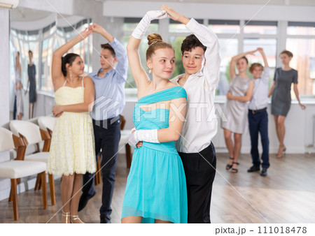 Boy and girl dancing waltz in studio Boy and girl dancing waltz in studio 111018478