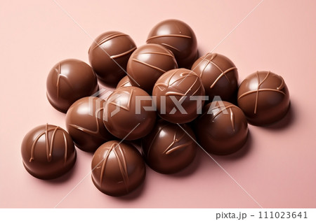 AI-generated content. Assorted Chocolate Eggs on Pink Surface, Delicious Easter Treats 111023641