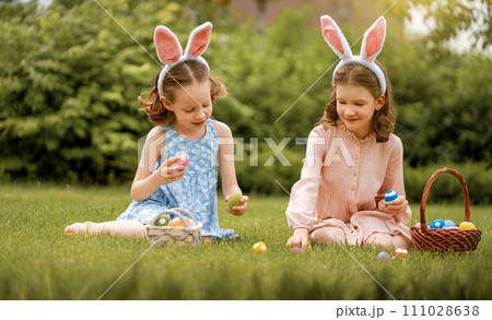 children with painting eggs outdoors children with painting eggs outdoors 111028638