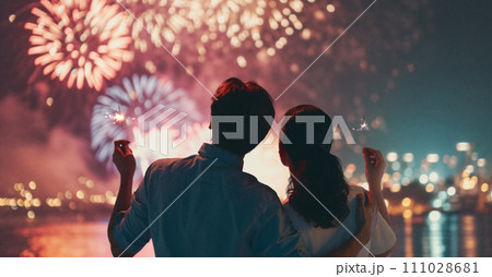 couple watching fireworks 111028681
