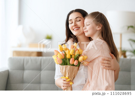 daughter and mom with flowers daughter and mom with flowers 111028695