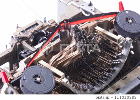 Broken metal typewriter, vintage object 111030585