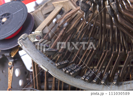 Broken metal typewriter, vintage object Broken metal typewriter, vintage object 111030589