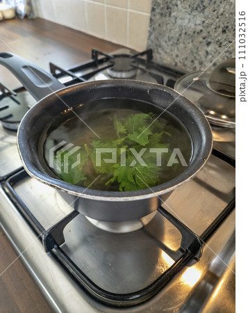 Freshly made hot peppermint tea in a pot Freshly made hot peppermint tea in a pot 111032516