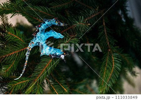 Resin Dragon Epoxy dragon ornament, symbolizing the upcoming 2024 Chinese Year of the Dragon in green pine tree, blending festive tradition with cultural significance. Resin Dragon Epoxy dragon ornament, symbolizing the upcoming 2024 Chinese Year of the Dragon in green pine tree, blending festive tradition with cultural significance. 111033849