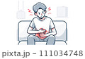 腹部に膨満感を覚えてお腹を押さえる男性 111034748