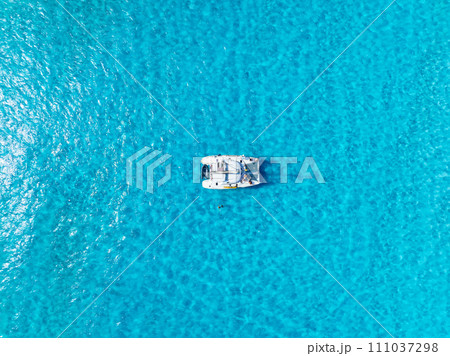 Drone view of a sailing yacht. Luxury transportation. Vacation and holidays. Drone view of a sailing yacht. Luxury transportation. Vacation and holidays. 111037298