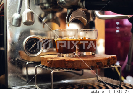 Coffee in a small cup from the maker 111039128