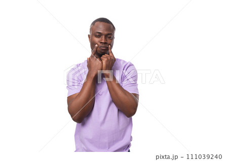 young shy handsome american man dressed in a light lilac basic t-shirt on a white background with 111039240