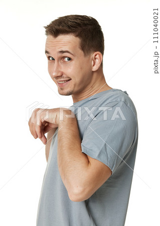 portrait of young funny man grimacing on white background portrait of young funny man grimacing on white background 111040021