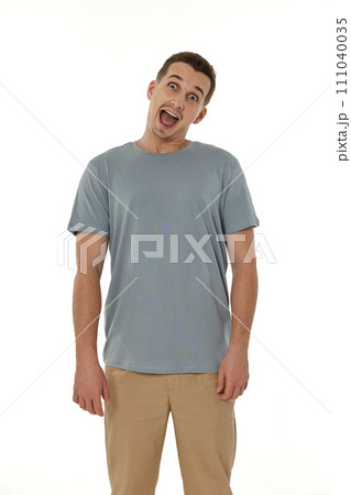 surprised guy looking at camera on white studio background surprised guy looking at camera on white studio background 111040035