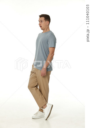 surprised guy looking at camera on white studio background 111040103