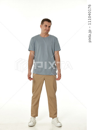 annoyed angry man standing on white studio background 111040176
