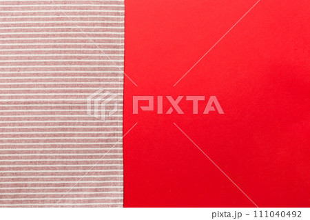top view with red empty kitchen napkin isolated on table background. Folded cloth for mockup with copy space, Flat lay. Minimal style 111040492