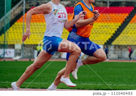blind male athlete runner with guide running race, summer para athletics championships blind male athlete runner with guide running race, summer para athletics championships 111040493