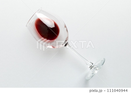 One glasses of red wine at wine tasting. Concept of red wine on colored background. Top view, flat lay design 111040944