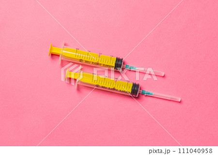 Top view of medical syringes on colorful background. Health care concept with copy space 111040958