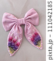 pink bow with embroidered delicate beautiful flowers in French knot technic 111042185