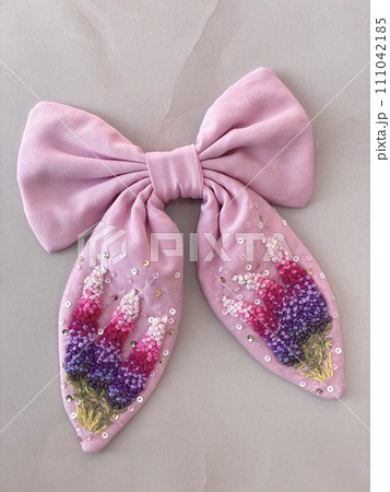 pink bow with embroidered delicate beautiful flowers in French knot technic 111042185