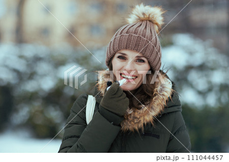 smiling 40 years old woman outdoors in park in winter 111044457