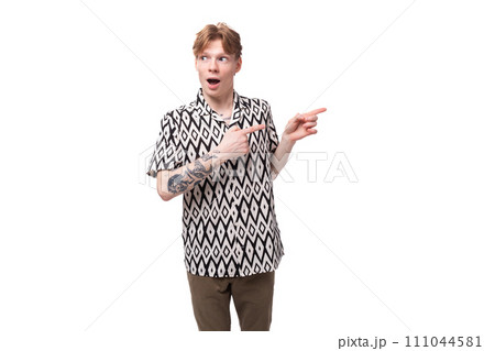 young friendly cute european man with golden hair is dressed in a stylish black and white shirt on a 111044581