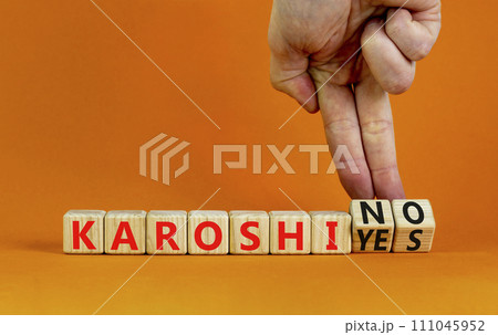 Karoshi yes or no symbol. Concept words Karoshi Yes or No on beautiful wooden blocks. Beautiful orange table orange background. Businessman hand. Business and stop karoshi concept. Copy space. Karoshi yes or no symbol. Concept words Karoshi Yes or No on beautiful wooden blocks. Beautiful orange table orange background. Businessman hand. Business and stop karoshi concept. Copy space. 111045952