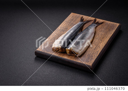 Pacific herring fillet marinated with salt, spices and herbs Pacific herring fillet marinated with salt, spices and herbs 111046370